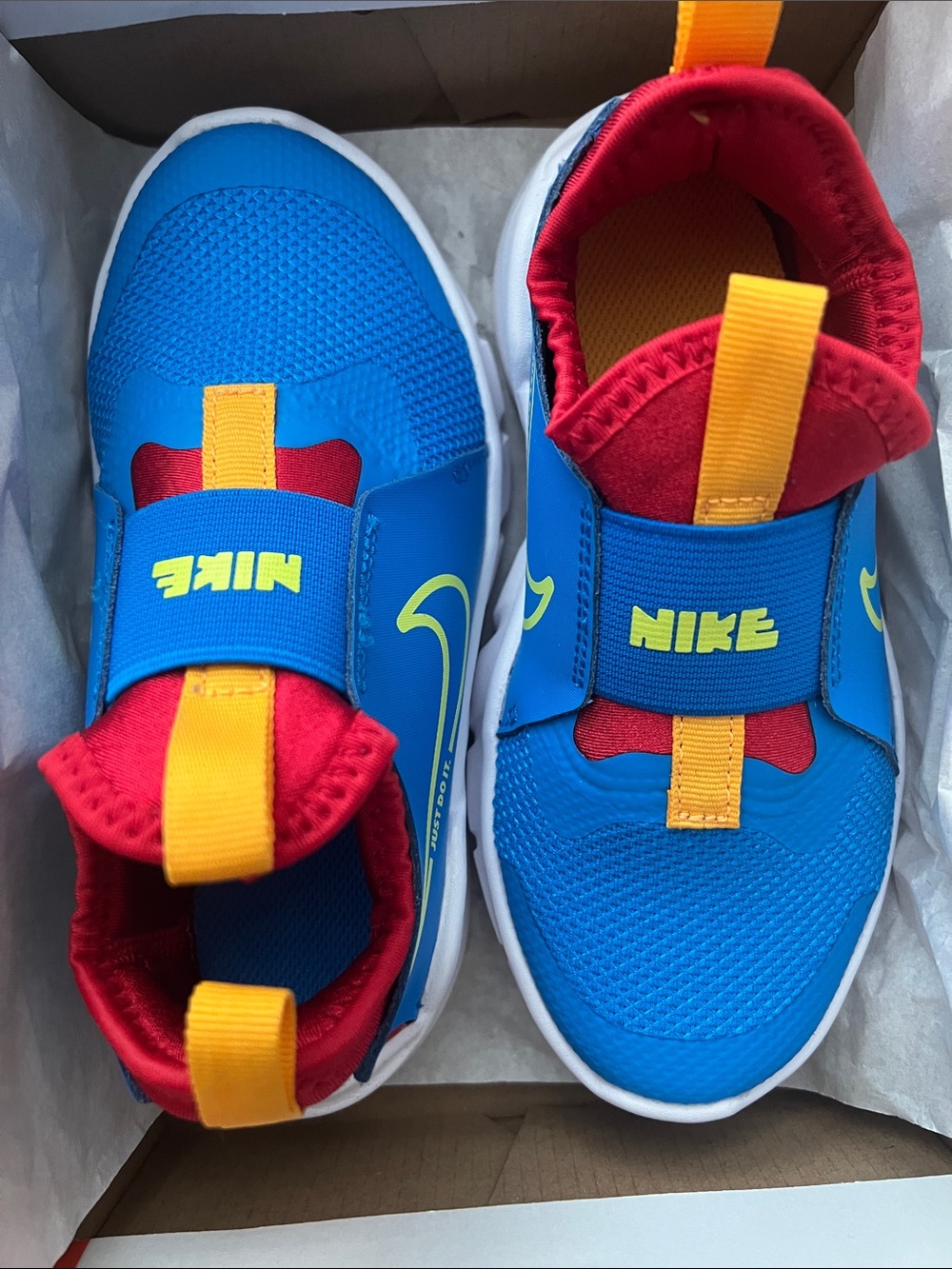 Nike Kids Blue Sneakers with Red and Yellow Accents